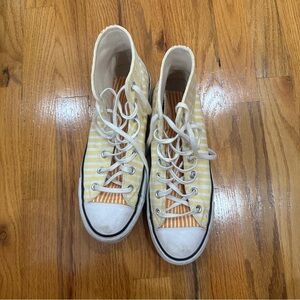 yellow and orange striped high top platform converse